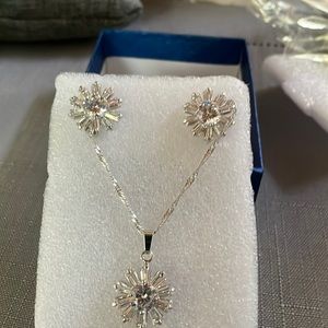 Silver tone necklace and earrings with clear diamondlike rhinestones